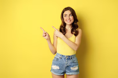portrait stylish summer girl brunette woman showing way pointing fingers left advertising standin 1258 119294
